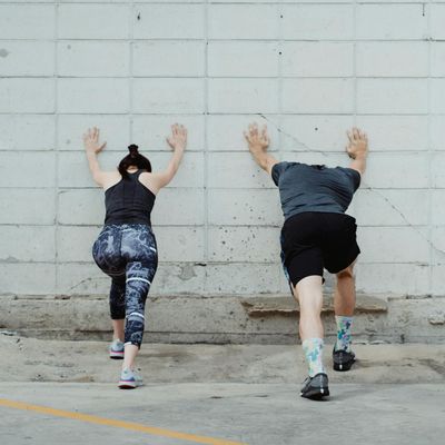 Athlete performing dynamic stretching before a workout session.