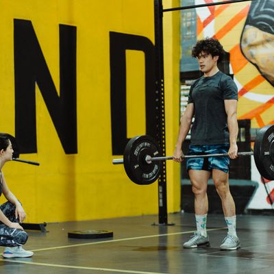 Man performing a deadlift with perfect form and control.