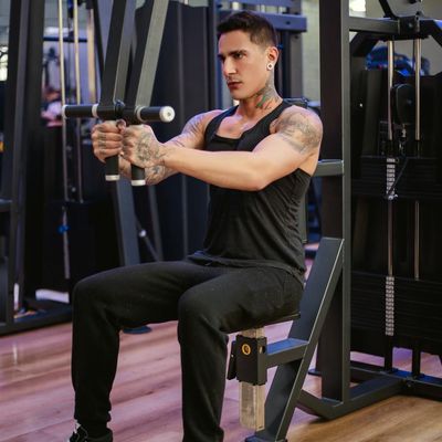 Modern gym interior with professional strength equipment and lighting.