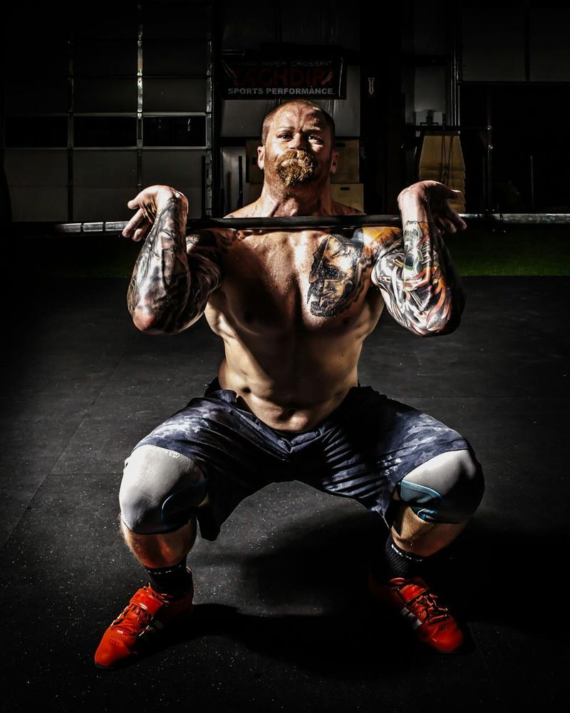 Serious male athlete focusing before a heavy set of squats.